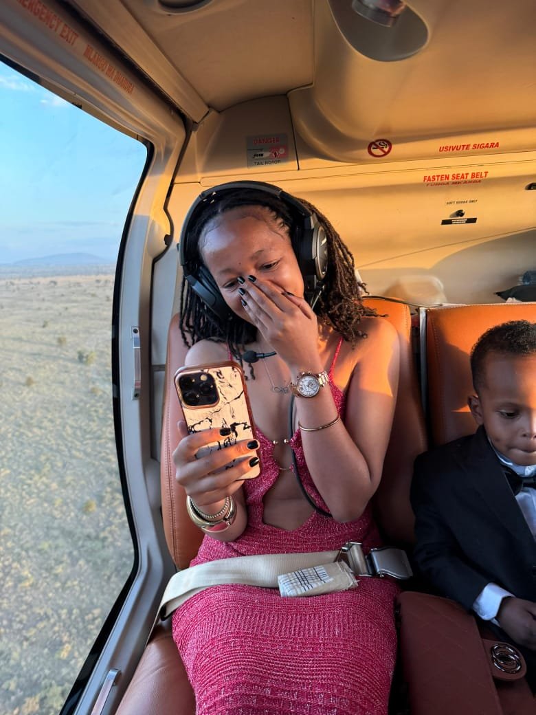 Guest laughing in the helicopter cabin over Nairobi